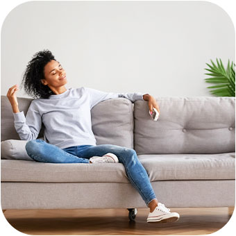 women relaxing on sofa