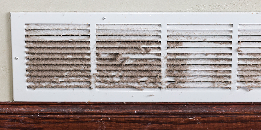 Home vent covered in dust.